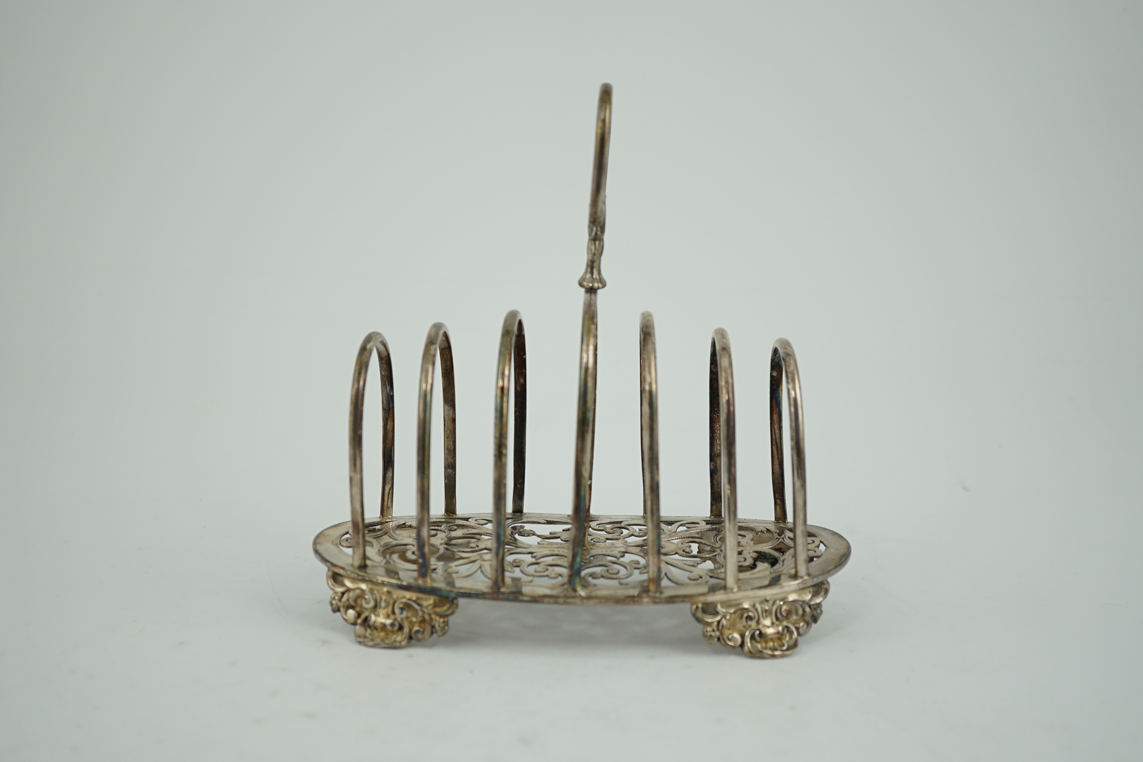 A Victorian silver seven bar toast rack, by Henry Holland